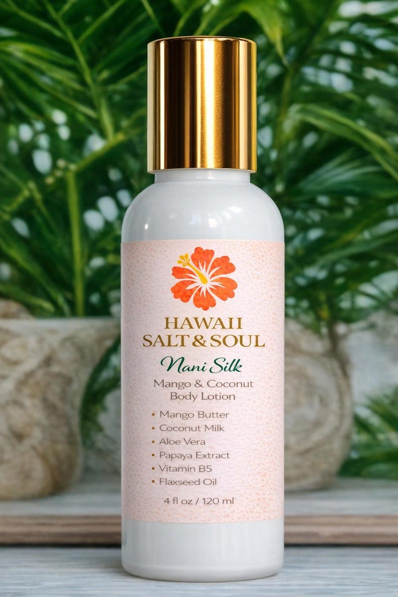 May include: White body lotion bottle with a gold cap, labeled "HAWAII SALT & SOUL Nani Silk Mango & Coconut Body Lotion." The label features a hibiscus flower and lists ingredients like mango butter and aloe vera. The bottle contains 4 fl oz / 120 ml.