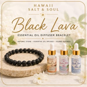 May include: A black lava stone essential oil diffuser bracelet alongside three small glass dropper bottles labeled Hawaii Salt & Soul Island Sunrise, Lanikai Bloom, and North Shore, set against a background with white floral accents.