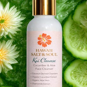 May include: A white bottle of "Hawaii Salt & Soul Kai Cleanse" face cleanser with a gold cap, 4 fl oz (120 ml). The label features a hibiscus flower and the words "Cucumber & Aloe". The background includes cucumber slices and flowers.