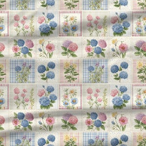 Cottagecore floral quilt fabric design with blue hydrangeas, pink flowers, and pastel botanical patchwork.