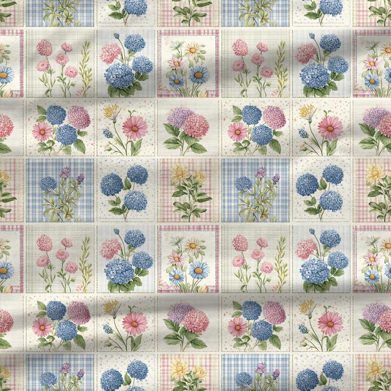 Cottagecore floral quilt fabric design with blue hydrangeas, pink flowers, and pastel botanical patchwork.
