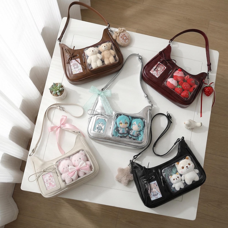 May include: An assortment of shoulder bags in various colors, including brown, silver, black, cream, and burgundy. Each bag features a clear window displaying plush toys or figurines. Some bags have decorative bows or charms.