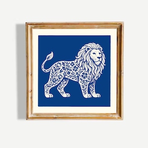 May include: A framed print featuring a white lion illustration on a deep blue background. The lion is decorated with floral patterns. The frame is a light gold color, adding a touch of elegance to the artwork. The artwork is square.