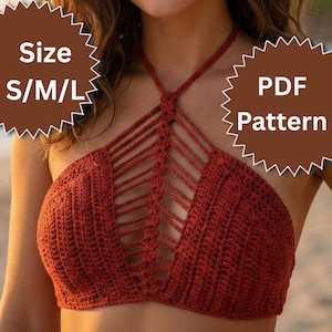 May include: A terracotta-coloured crochet halter top with an intricate openwork design. The top has a halter neck and a detailed pattern across the chest. The image includes the text "Size S/M/L" and "PDF Pattern".