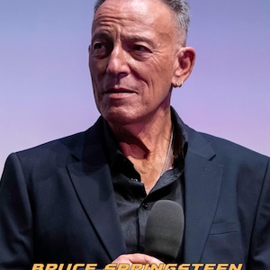 May include: A 2027 calendar featuring a portrait of Bruce Springsteen wearing a black blazer and black shirt, holding a microphone. The text reads BRUCE SPRINGSTEEN CALENDAR 2027, with smaller text below in multiple languages.