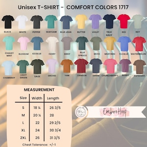 Pode incluir: Uma exibi&ccedil;&atilde;o de camisetas unissex Comfort Colors 1717 em v&aacute;rias cores, incluindo preto, branco e vermelho. A imagem tamb&eacute;m mostra uma tabela de tamanhos com medidas em cent&iacute;metros e o logotipo EmbroHoop.