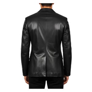 May include: A black leather blazer with a classic design. The jacket features a notched lapel, two-button closure, and a single vent in the back. The blazer is a solid black color and appears to be well-tailored.