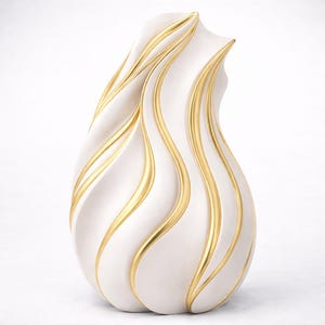 May include: A white decorative vase with a flowing, organic shape. Gold-colored accents run vertically along the vase, creating a striking contrast. The vase has a smooth, glossy finish and is suitable for home decor.