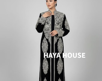 May include: A black floor-length dress and matching jacket with intricate silver embroidery. The jacket has a high collar and long sleeves. The text "HAYA HOUSE" is displayed in white.