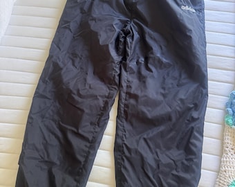 Vintage adidas nylon track or wind pants. They feature a classic sporty design with a lightweight, slightly wrinkled fabric typical of nylon