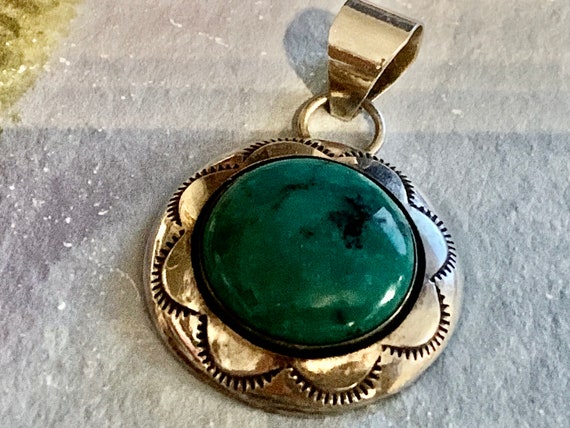 Navajo Trading Post Embossed Turquoise Pendant.