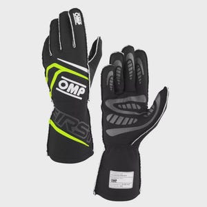 Op de afbeelding: Zwarte en neon groene racehandschoenen met het OMP-logo. De handschoenen hebben witte accenten en een label op de pols. Het woord "FIRST" staat in grote letters op de zijkant van de handschoenen.