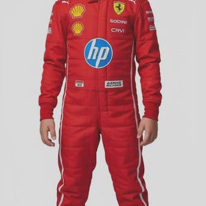 May include: A red racing suit with white stripes and logos, including "HP" and "Ferrari", worn by a young person. The suit has long sleeves and is paired with red shoes. The overall theme is motorsports.