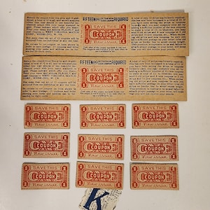 May include: A sheet of coupons with the text "Save This Coupon New Issue" printed on each coupon. The coupons are red and white and have a border around them. The text "Fifteen (15) of this new issue required" is printed at the top of the sheet.