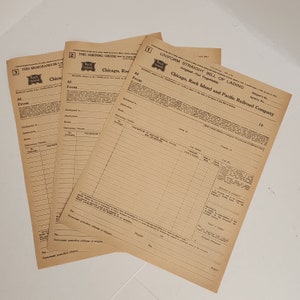 May include: Three vintage shipping documents from the Chicago, Rock Island and Pacific Railroad Company. The documents are tan with black text and include the Rock Island logo. The documents are labeled as a shipping order, a bill of lading, and a memorandum.