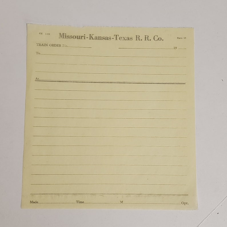 May include: A vintage yellowed paper form from the Missouri-Kansas-Texas R.R. Co. The form is lined and includes fields for a train order number, destination, and other details. The text "Missouri-Kansas-Texas R. R. Co." is printed at the top.