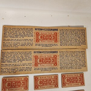 May include: A set of vintage coupons for pencils. Each coupon is red and white with the text "Save This Coupon" and "New Issue". The coupons require fifteen to be redeemed for a set of pencils.