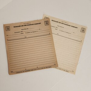May include: Two vintage train order forms from the Seaboard Air Line Railroad Company. The forms are printed on tan paper and have lines for writing. The forms are labeled "Form 19" and have the company name and "Train Order No." printed at the top.