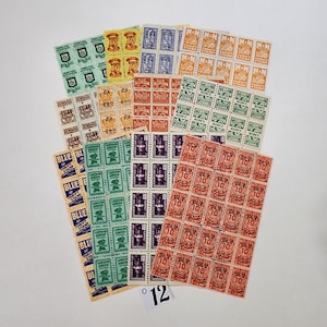 May include: A collection of vintage postage stamps, featuring various designs and colors, including blue, green, orange, and purple. The stamps are arranged in rows and columns, with the text "DLW 10" visible on some of the stamps.