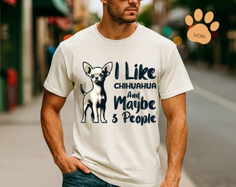 May include: Ivory-colored t-shirt featuring a black and white Chihuahua illustration with the text "I Like Chihuahua And Maybe 3 People" in navy blue. The design is centered on the front of the shirt, making it a statement piece for dog lovers.