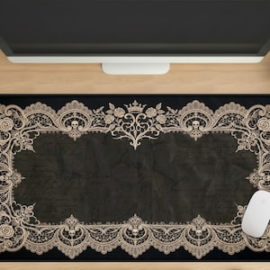 May include: A white ceramic mug with a black handle and the text "But First, Coffee" in a black, handwritten-style font. The mug is on a white surface.