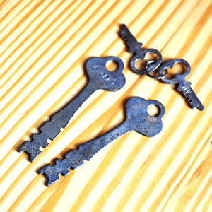 2 sets of matching antique keys