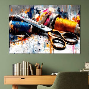 May include: An abstract painting of sewing tools. A pair of scissors with gold handles rests on a white surface, next to spools of blue and orange thread. The background features colorful paint splatters.