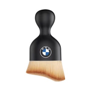 May include: Black makeup brush with a rounded handle and a flat, angled brush head. The brush features the BMW logo in the center. The bristles are light brown with a darker brown gradient at the base.