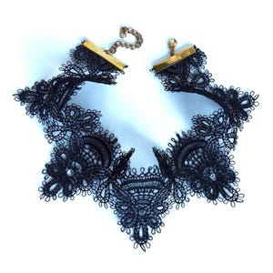 Black lace choker laid out on light surface showing gold (GP) hook and chain closure, will be upgraded to larger hook at no additional charge