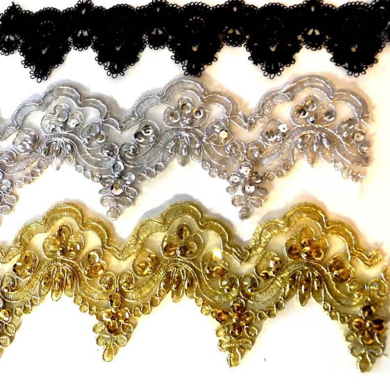 showing three styles available in wide lace chokers in black, silver and gold