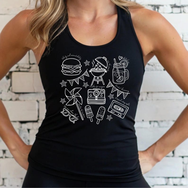 A woman wearing a black tank top with a graphic design featuring various icons and objects, such as a hamburger, a windmill, and a drink, against a white brick wall background.