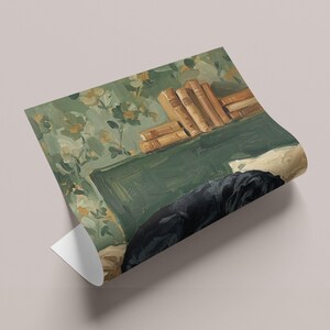 The cozy dog artwork styled in a dark wood frame, resting on a study desk next to vintage books and a classic brass lamp in a home library.