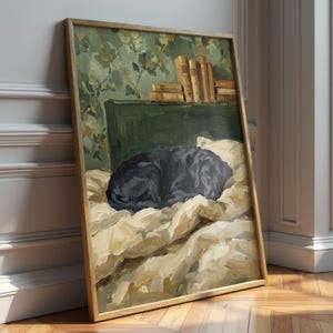Framed sleeping black Lab print displayed on a nightstand in a cozy cottagecore bedroom with soft linens and warm lighting.