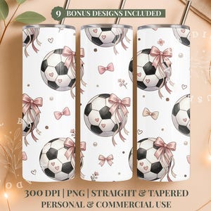 May include: Three white stainless steel tumblers with a soccer ball design. Each tumbler features a black and white soccer ball with a pink bow and hearts. The design includes pink bows, hearts, and floral accents. The tumblers have a silver straw and the text "9 BONUS DESIGNS INCLUDED".