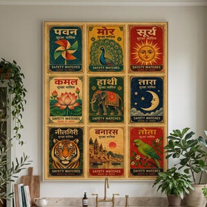 May include: A rectangular wall art print featuring a grid of nine vintage-style Indian matchbox labels. Each label displays unique illustrations including a pinwheel, peacock, sun, lotus, elephant, crescent moon, tiger, cityscape, and parrot.