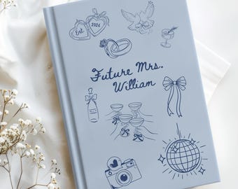 May include: A light blue wedding guest book with a variety of line art illustrations, including hearts, doves, champagne glasses, and a disco ball. The text "Future Mrs. William" is written in elegant script.
