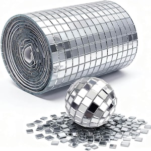 May include: A roll of silver mirror tiles featuring a grid of small square reflective pieces, accompanied by a spherical disco ball covered in matching square mirror tiles and a scattered pile of individual loose square mirror tiles.