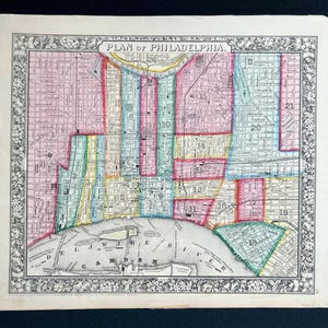 May include: Antique map of Philadelphia, featuring a detailed city plan with colorful sections. The map includes the Delaware River and surrounding areas, framed by a decorative border. The title "PLAN OF PHILADELPHIA" is at the top.