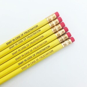 Snap in case of frustration Pencil set of in yellow. image 7