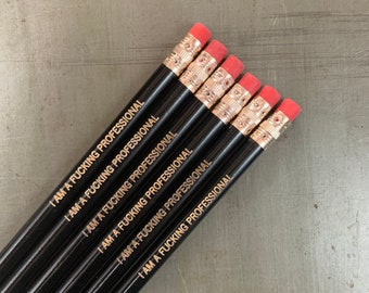 i am a fvcking professional profanity Pencil set of engraved pencils in black. MATURE swears.