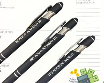 May include: Three black pens with silver accents and engraved sayings. The pens read "Be Audit You Can Be", "Did You Document It?", and "It's Accrual World".