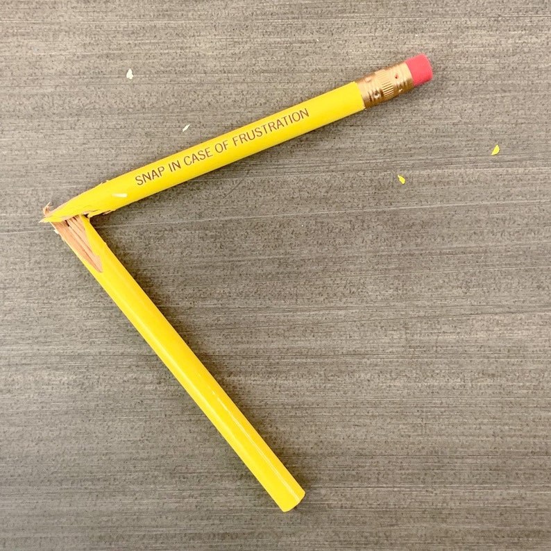 Snap in case of frustration Pencil set of in yellow. image 1