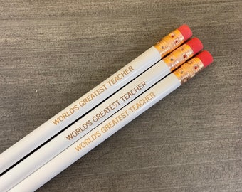 world's greatest teacher engraved pencils in white . Multiple quantities available. Make a teacher's day.