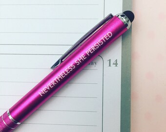 nevertheless she persisted hot pink stylus pen. black ink inside.