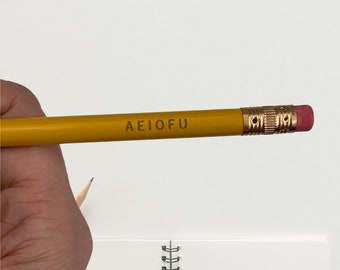 buy a vowel AEIOFU engraved pencils in classic yellow.