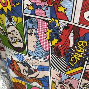 May include: A vibrant comic book panel design featuring bold colors and dynamic text. The artwork includes speech bubbles with words like "BANG!" and "OMG!", and illustrations of characters in various poses. The overall theme is a pop art style.