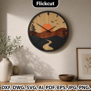 May include: A circular wall clock with a black frame featuring a layered wooden landscape design. The scene depicts a light wood sky with an orange sun, dark wood rolling hills, a winding path, and black silhouettes of birds and foliage.