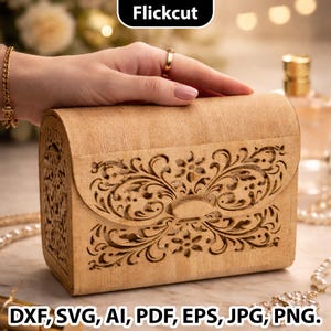 May include: A light brown wooden box with intricate floral cut-out designs on the front flap and body. The box is rectangular with a curved top. The text "Flickcut" is at the top, and "DXF, SVG, AI, PDF, EPS, JPG, PNG" is at the bottom.