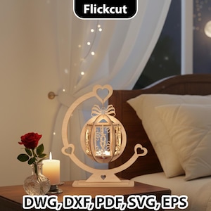 May include: A wooden lantern with a heart-shaped design, bow, and candle holder. The lantern is on a wooden stand with a heart-shaped base. A red rose in a vase and a lit candle are on a wooden table. The text "Flickcut" is at the top.