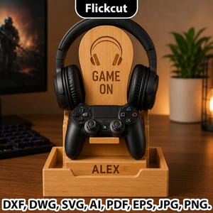 May include: A light-colored wooden gaming stand featuring a headphone hanger and a controller mount. The stand is engraved with a headphone icon, the text "GAME ON," and the name "ALEX" on the base. It holds black over-ear headphones and a black game controller.
